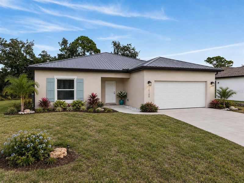 Front exterior of a new home in , Port Charlotte, FL, highlighting curb appeal (Image 2). Front exterior of a new home in , Port Charlotte, FL, highlighting curb appeal (Image 2).