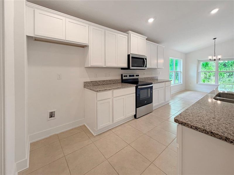 Furnished interior view inside a new home in Harmony Central, Harmony (Image 7).