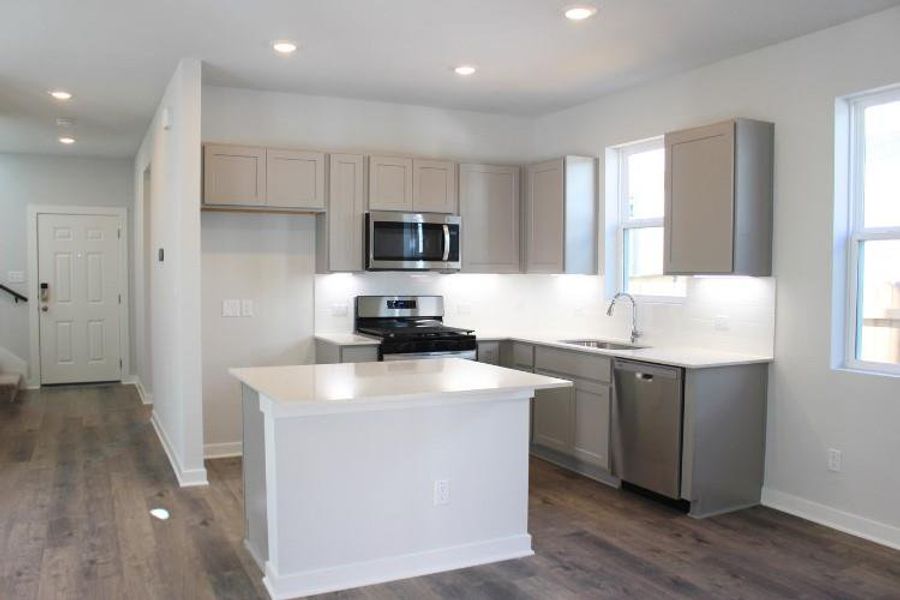 Furnished interior view inside a new home in The Hollows at Avery Centre, Round Rock (Image 3).
