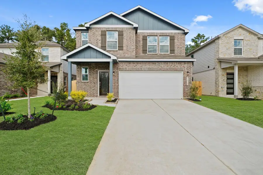 Front exterior of a new home in Lakes at Black Oak, Magnolia, TX, highlighting curb appeal (Image 2).