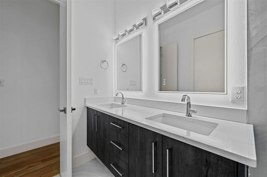 Bathroom with hardwood / wood-style flooring and vanity