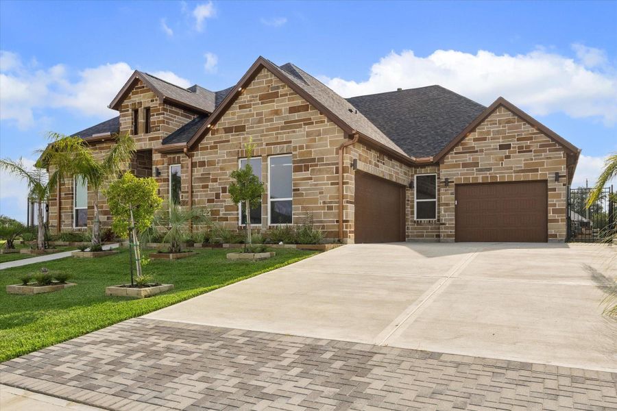 Front exterior of a new home in , Kemah, TX, highlighting curb appeal (Image 23). Front exterior of a new home in , Kemah, TX, highlighting curb appeal (Image 23).