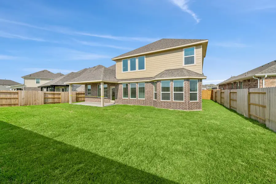 Front exterior of a new home in Marvida, Cypress, TX, highlighting curb appeal (Image 2). Front exterior of a new home in Marvida, Cypress, TX, highlighting curb appeal (Image 2).