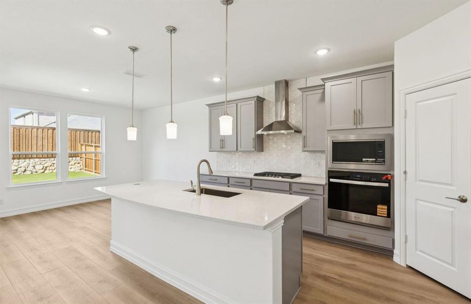 Spacious kitchen with eat-in bartop island