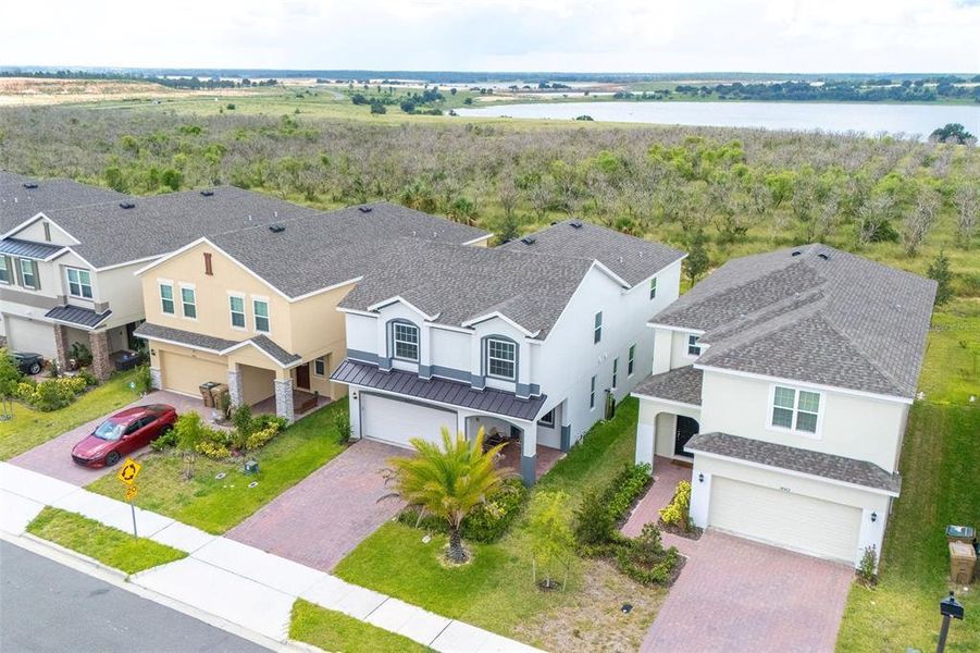 Front exterior of a new home in , Clermont, FL, highlighting curb appeal (Image 20).