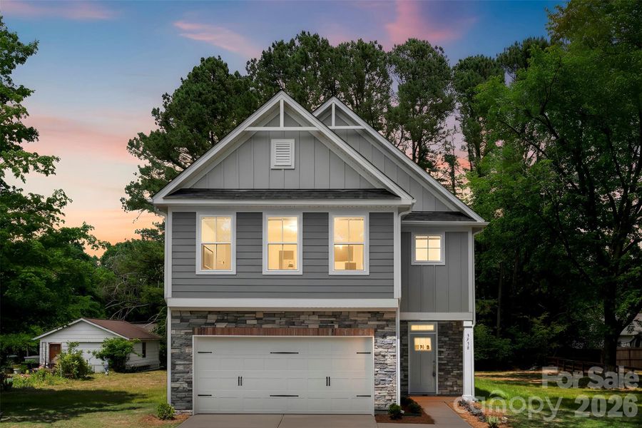 Front exterior of a new home in , Harrisburg, NC, highlighting curb appeal (Image 1). Front exterior of a new home in , Harrisburg, NC, highlighting curb appeal (Image 1).