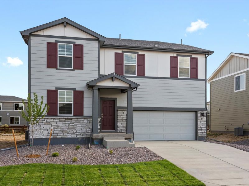 Front exterior of a new home in Revere at Johnstown, Johnstown, CO, highlighting curb appeal (Image 1). Front exterior of a new home in Revere at Johnstown, Johnstown, CO, highlighting curb appeal (Image 1).