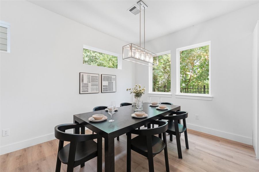 Dining area flows seamlessly between the living room and kitchen for easy entertaining. Dining area flows seamlessly between the living room and kitchen for easy entertaining.