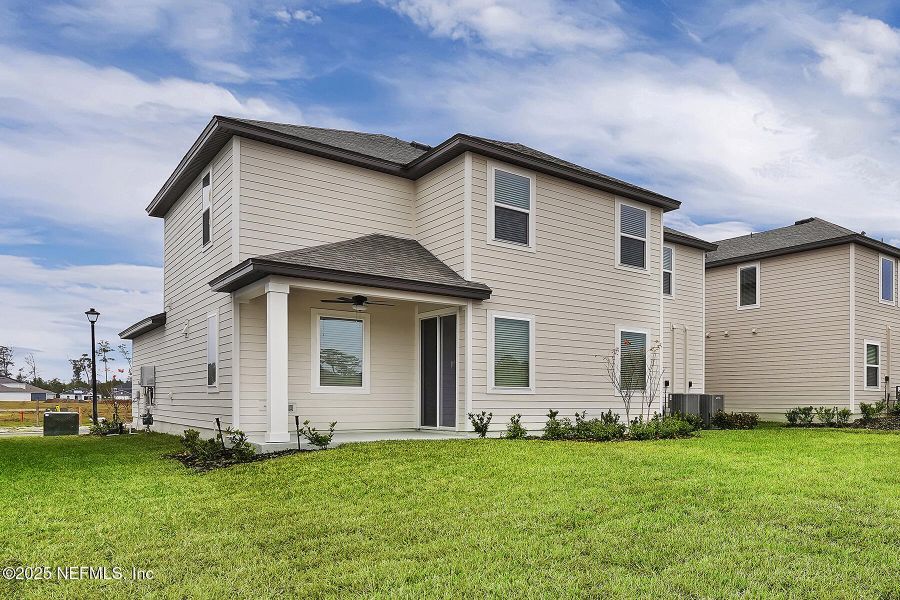 Front exterior of a new home in Jennings Farm, Middleburg, FL, highlighting curb appeal (Image 1).