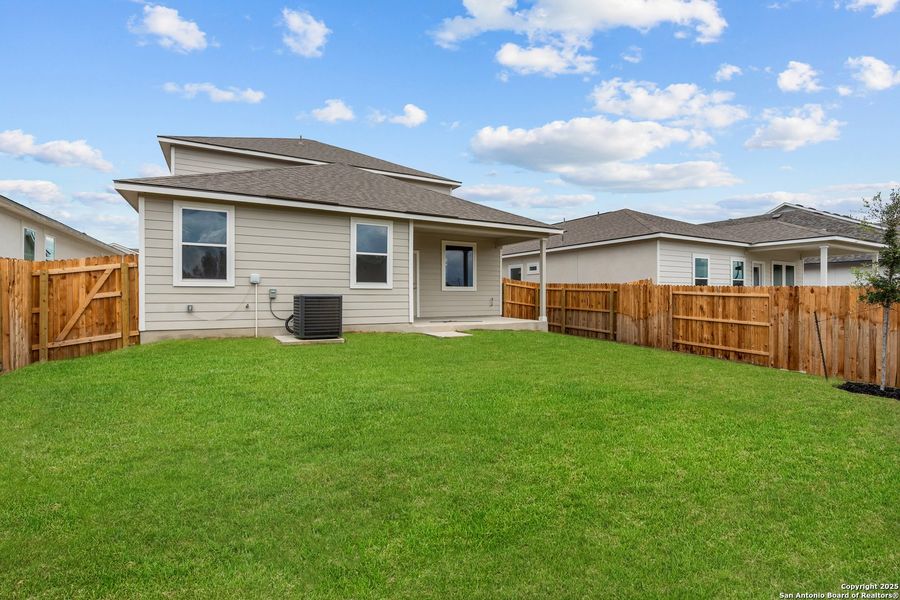 Front exterior of a new home in August Fields, New Braunfels, TX, highlighting curb appeal (Image 16). Front exterior of a new home in August Fields, New Braunfels, TX, highlighting curb appeal (Image 16).