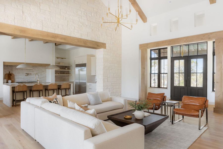 Light and breezy living area looking towards chef's kitchen!