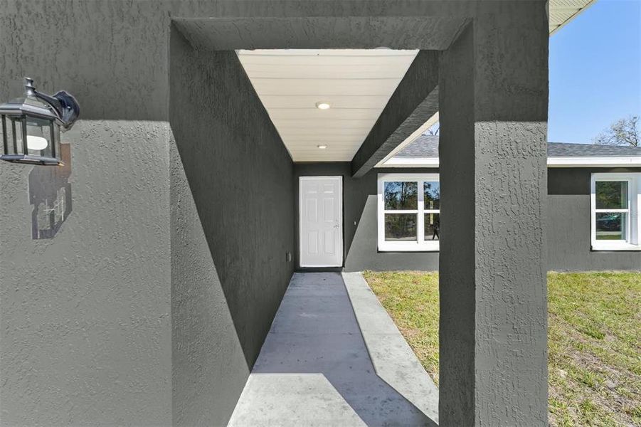 Front exterior of a new home in , Belleview, FL, highlighting curb appeal (Image 1).