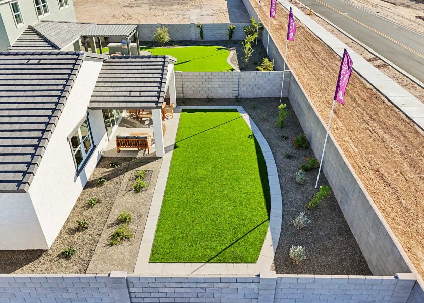 A backyard with a small pond. A backyard with a small pond.