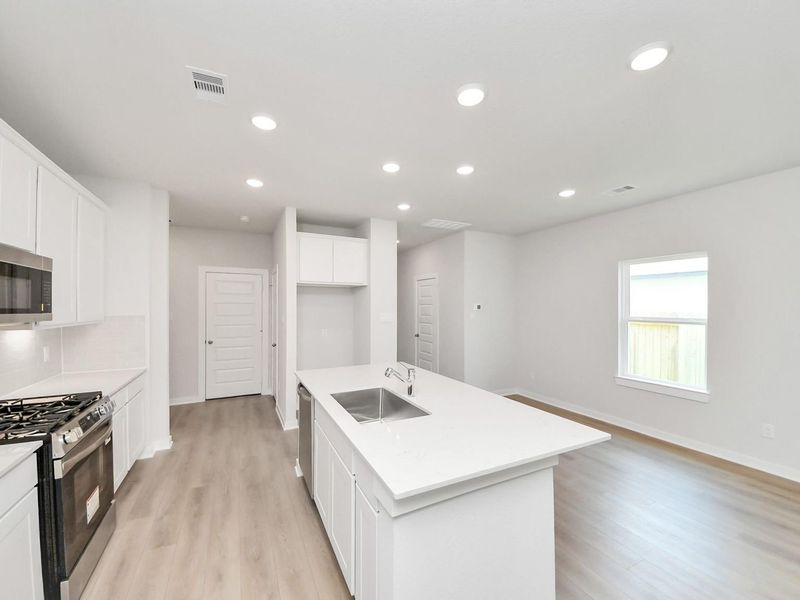 Furnished interior view inside a new home in Caney Creek Place, Conroe (Image 8).
