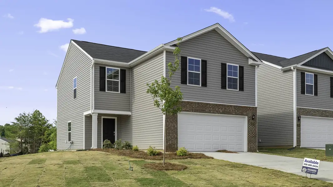 Front exterior of a new home in Willow Mill, Thomasville, NC, highlighting curb appeal (Image 13).