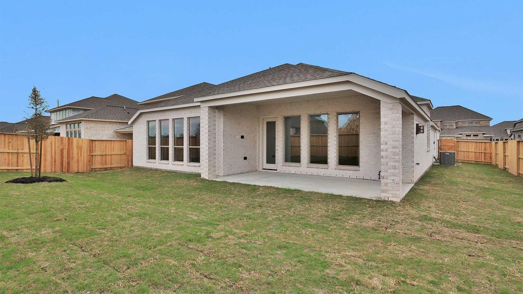 Exterior details and patio area of a home in Meridiana, Manvel (Image 4).