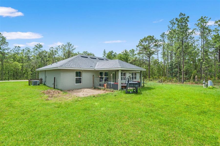 Exterior details and patio area of a home in Royal Highlands, Brooksville (Image 24).