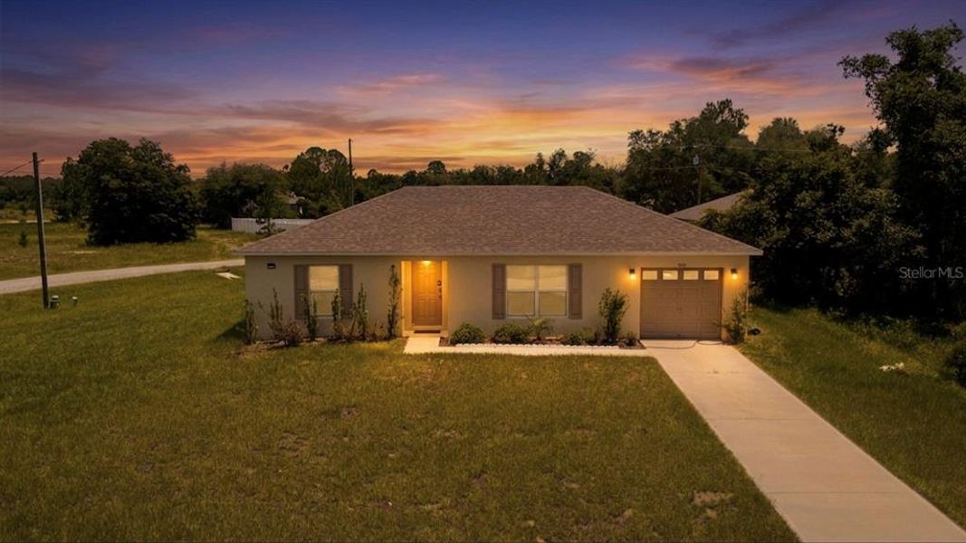 Front exterior of a new home in Poinciana, Poinciana, FL, highlighting curb appeal (Image 22). Front exterior of a new home in Poinciana, Poinciana, FL, highlighting curb appeal (Image 22).