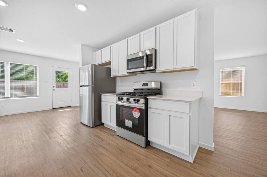 Another view of the kitchen with the appliances. Another view of the kitchen with the appliances.