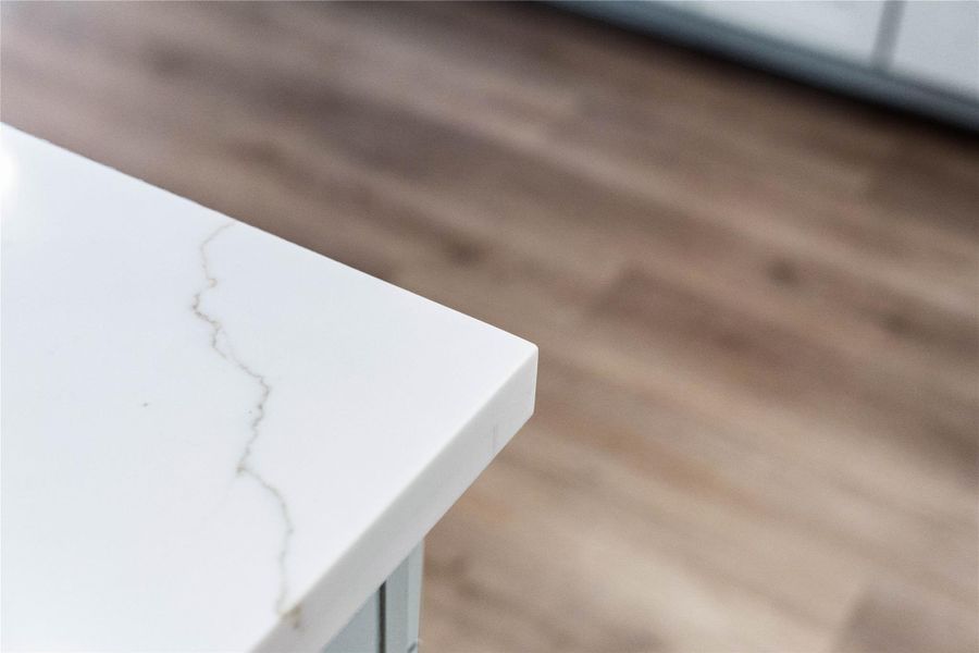 This striking quartz countertop combines the elegant, deep-veined look of natural stone with a highly durable, non-porous surface that is exceptionally resistant to scratches, stains, and daily wear.