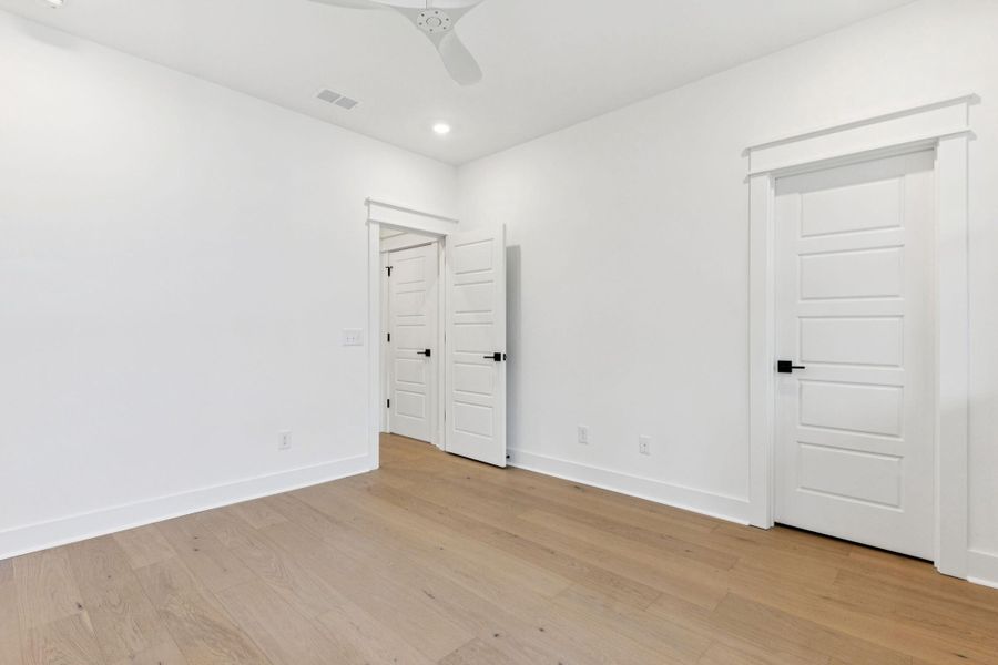 Spacious, unfurnished interior of a new home in Overlook at Copahee Sound, Awendaw (Image 51).