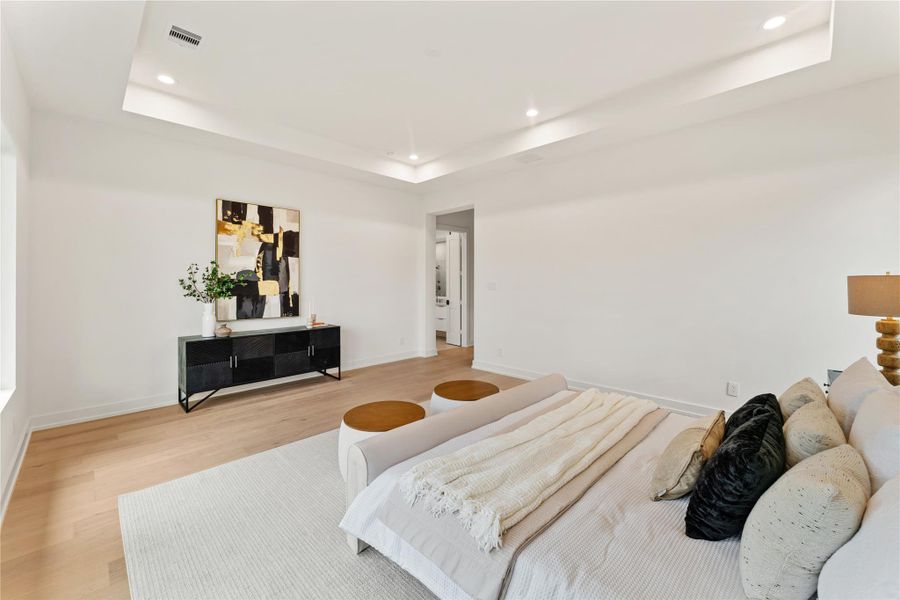 Another view of the primary bedroom suite.