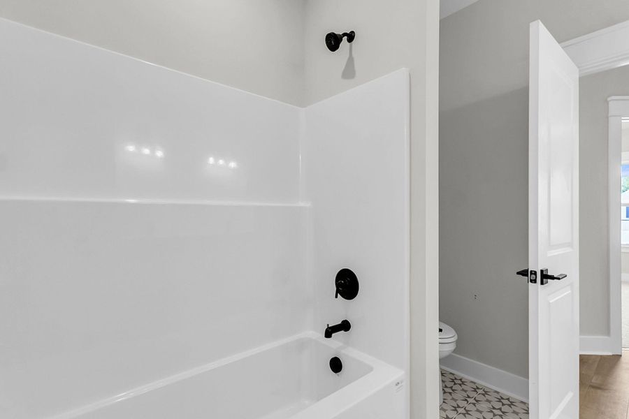 Furnished interior view inside a new home in Tidewater at Lakes of Cane Bay, Summerville (Image 13).