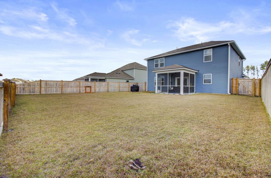 Exterior details and patio area of a home in Sanctuary Cove at Cane Bay, Summerville (Image 31).