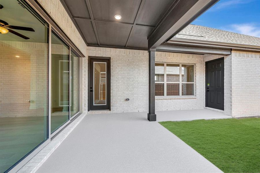 View of patio featuring ceiling fan
