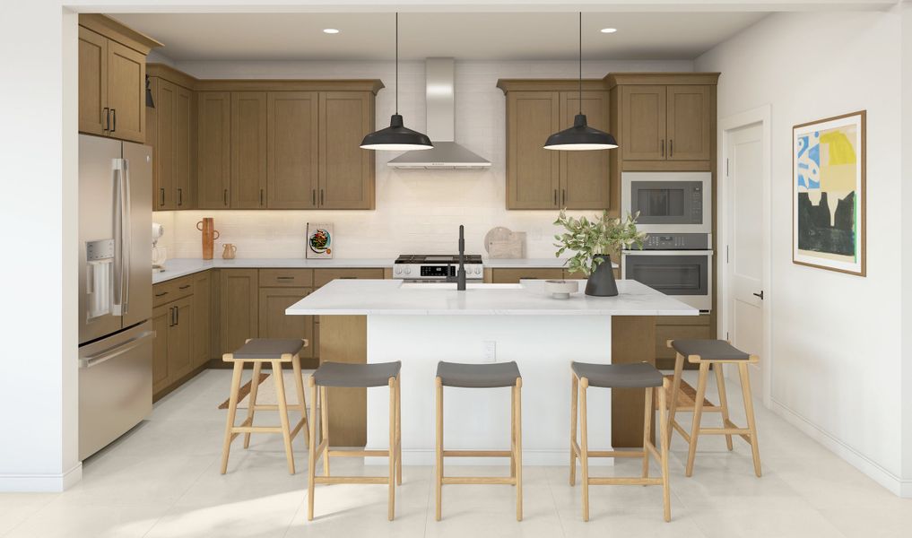 Kitchen with stainless steel hood and pendant lighting