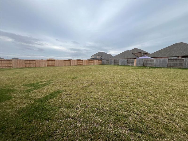 Welcome to your dream backyard! This expansive, fully fenced yard offers endless possibilities—perfect for outdoor activities, gardening, or creating your own private oasis. Space, privacy, and potential await!