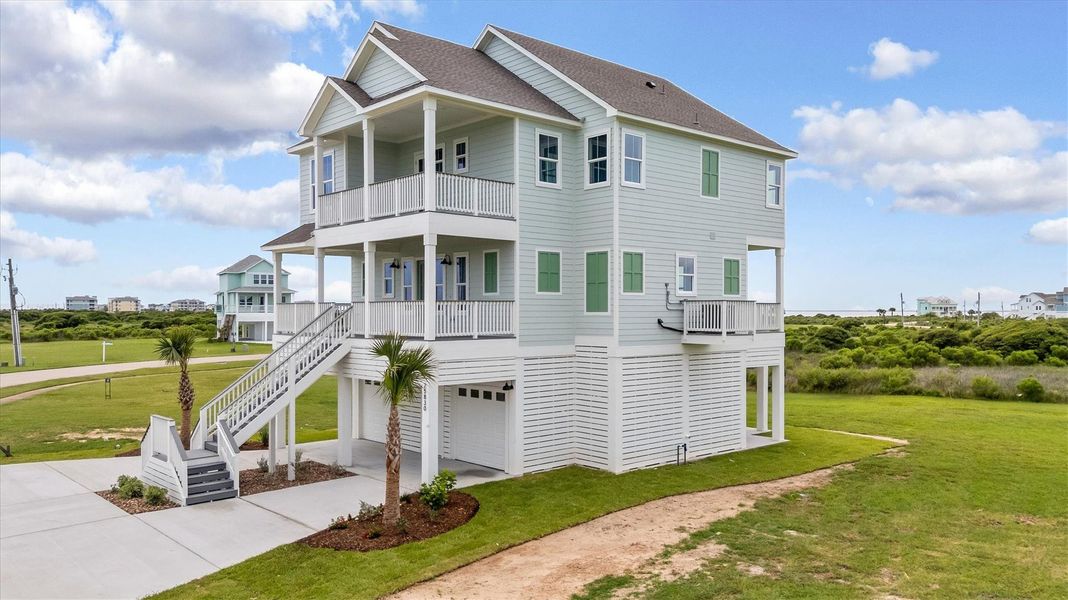 Front exterior of a new home in , Galveston, TX, highlighting curb appeal (Image 1).