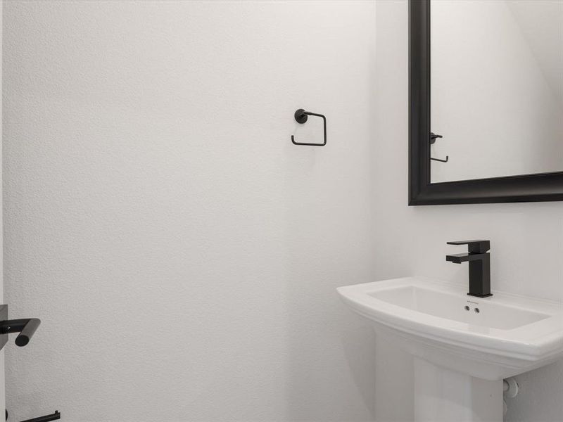 Powder Bath with pedestal sink and framed mirror Powder Bath with pedestal sink and framed mirror