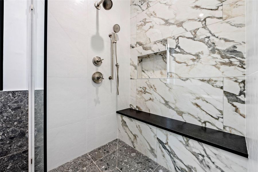 Full bath featuring a marble finish shower