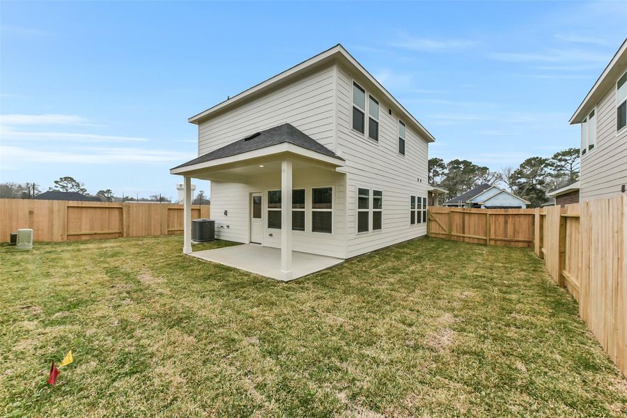 Exterior details and patio area of a home in King Oaks Village, Baytown (Image 3).