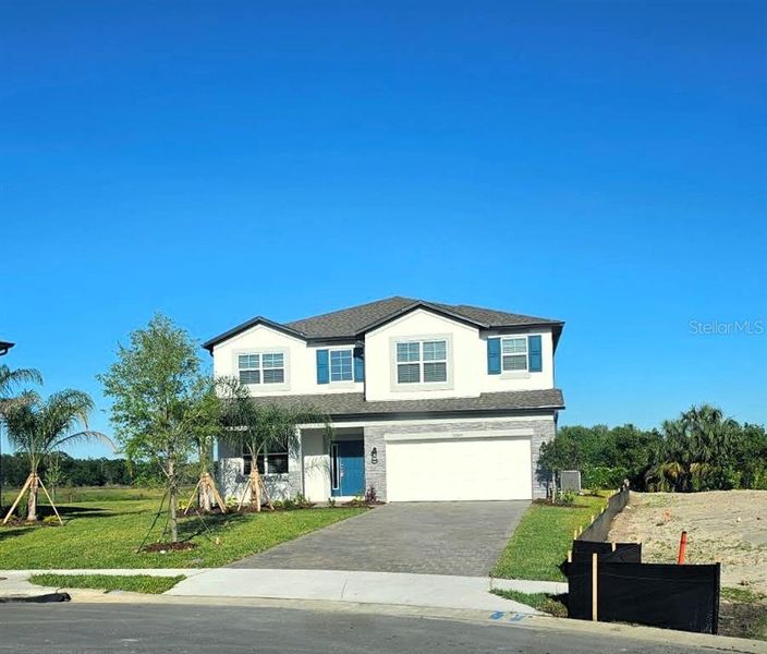 Front exterior of a new home in , Zephyrhills, FL, highlighting curb appeal (Image 1). Front exterior of a new home in , Zephyrhills, FL, highlighting curb appeal (Image 1).