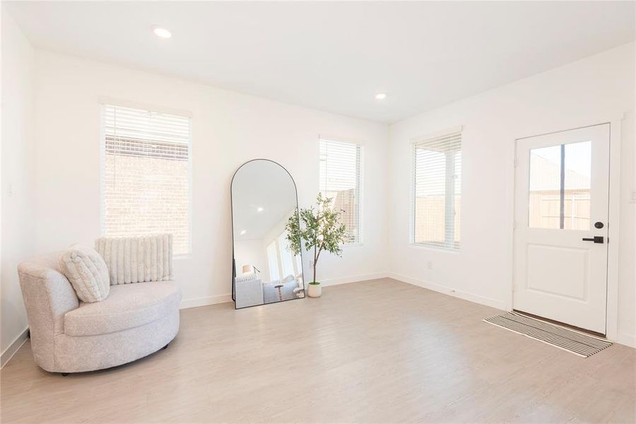 Unfurnished room with recessed lighting and light wood-style flooring Unfurnished room with recessed lighting and light wood-style flooring