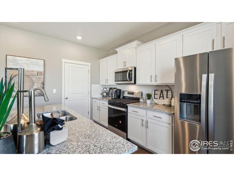 Furnished interior view inside a new home in Vista Meadows, Fort Lupton (Image 23).