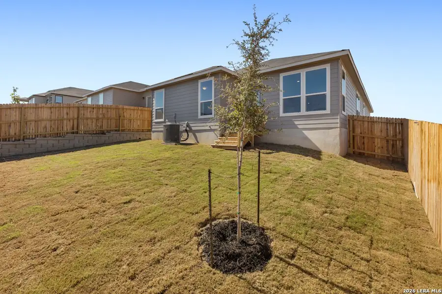 Exterior details and patio area of a home in Knox Ridge, Converse (Image 19).