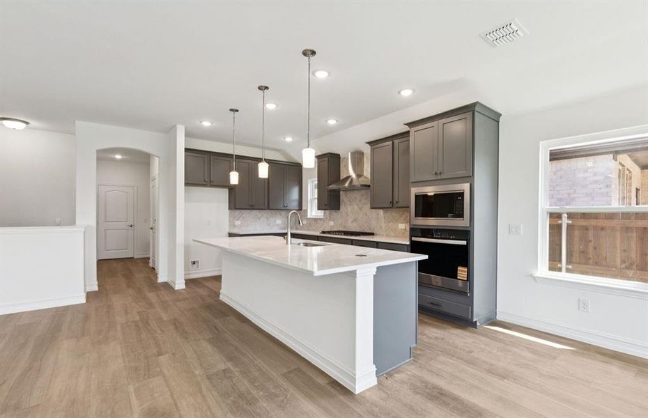 Open kitchen layout perfect for entertaining and creating a connected home environment *Real home pictured Open kitchen layout perfect for entertaining and creating a connected home environment *Real home pictured