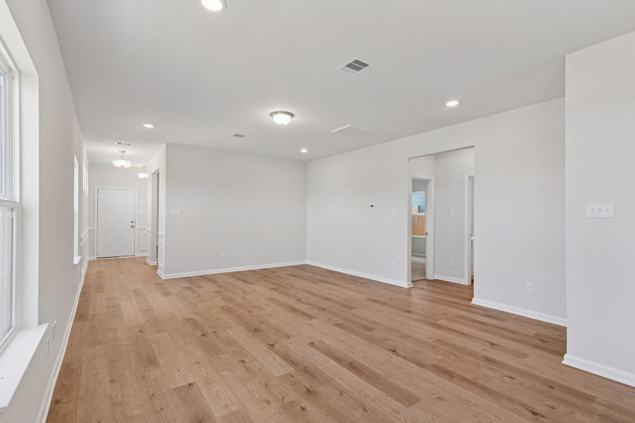 The Blue Jay II- Kitchen into the Family Room. Home under construction. Sample floor plan photo used for illustrative purposes only. Upgrades, selections options, windows and colors may vary. The Blue Jay II- Kitchen into the Family Room. Home under construction. Sample floor plan photo used for illustrative purposes only. Upgrades, selections options, windows and colors may vary.