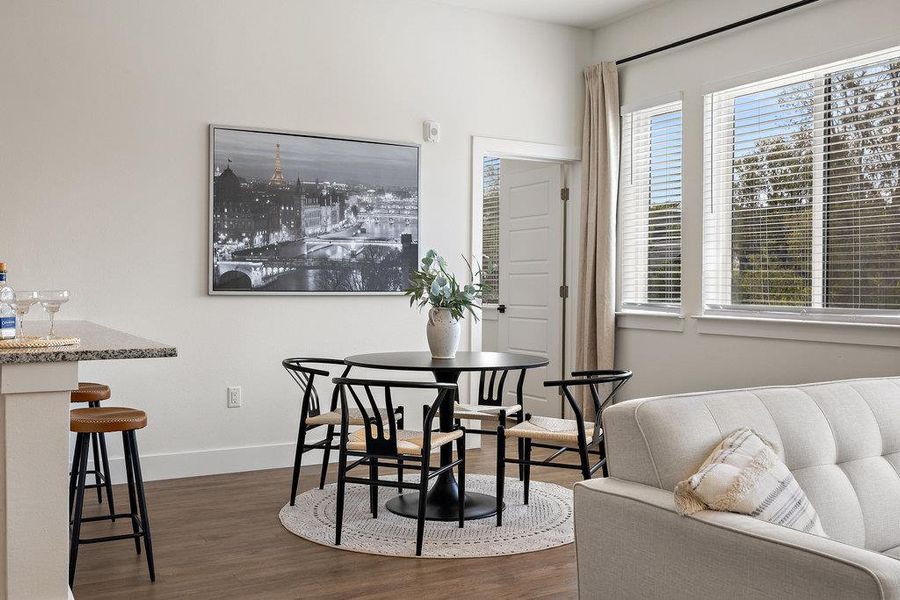 Dining area with dark wood finished floors