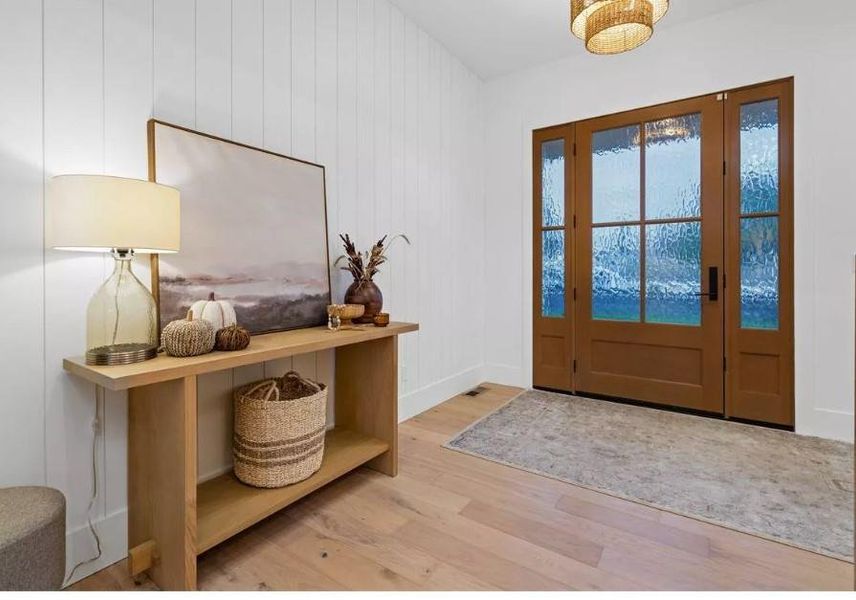 Vaulted Ceiling Entry with Luxury vinyl wood-style flooring, Ship Lap Walls