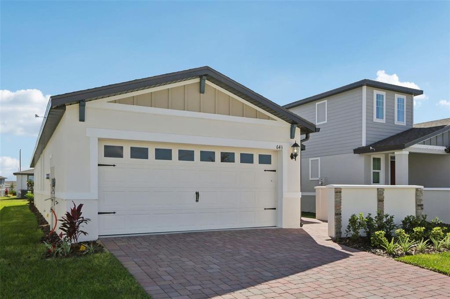 Front exterior of a new home in Springs at Lake Alfred - Classic Series, Lake Alfred, FL, highlighting curb appeal (Image 1).