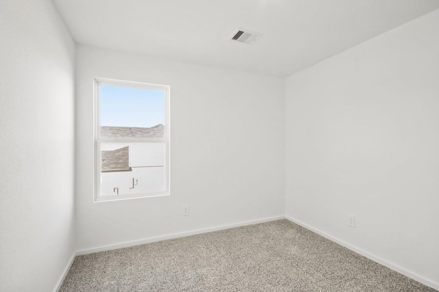 Spacious, unfurnished interior of a new home in Sunterra, Katy (Image 7).