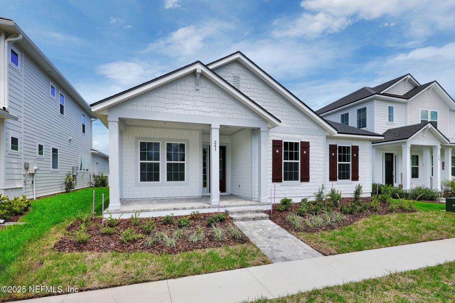 Front exterior of a new home in Seabrook Village at Seabrook, Ponte Vedra, FL, highlighting curb appeal (Image 19).