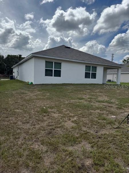 Exterior details and patio area of a home in Hernando County Spot Lots, Spring Hill (Image 20).