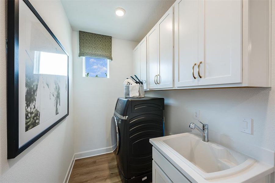 Furnished interior view inside a new home in Esplanade at Wellen Park, Englewood (Image 11).