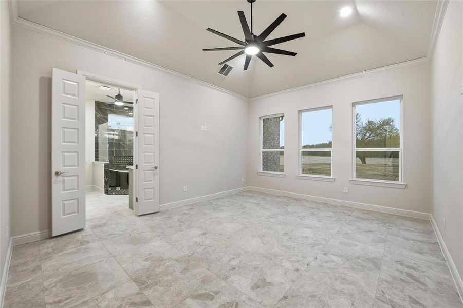 Spare room with ornamental molding and ceiling fan Spare room with ornamental molding and ceiling fan