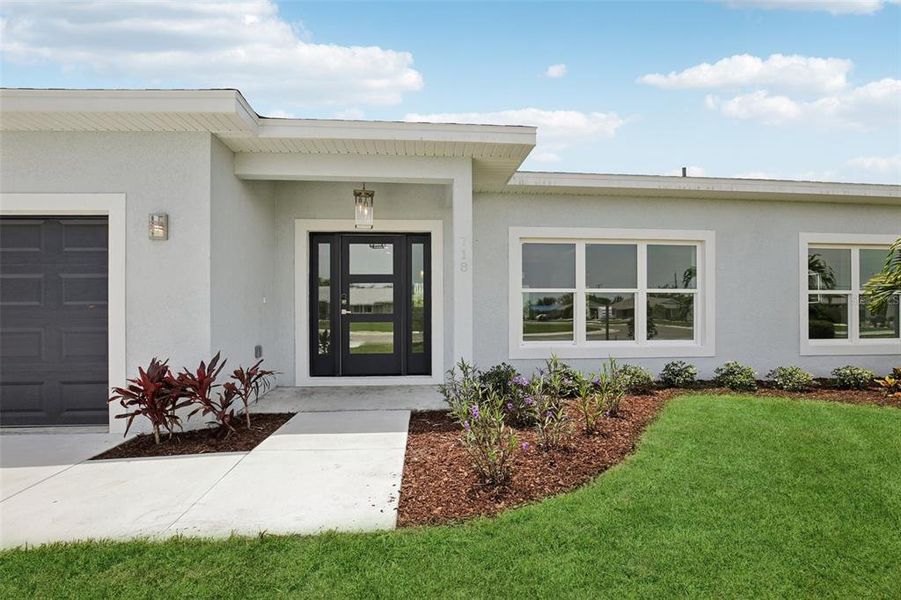 Front exterior of a new home in , Sun City Center, FL, highlighting curb appeal (Image 25).